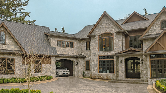 Home Inspection of a beautiful house with a stone facade.